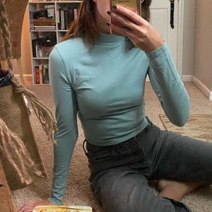 blue mock-neck top